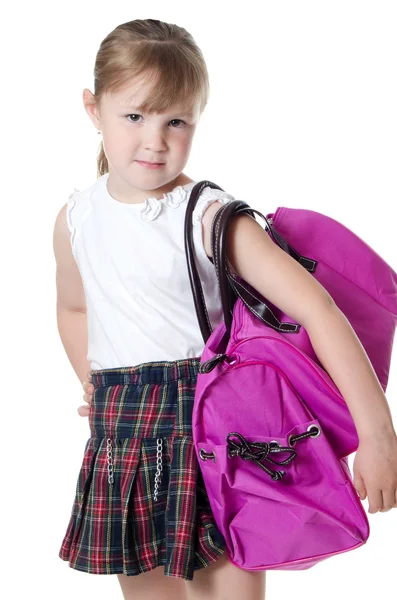 Het kleine meisje met een Lila zak geïsoleerd — Stockfoto