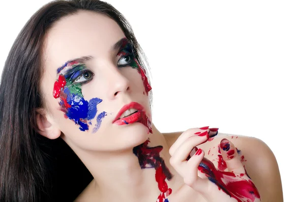 A gyönyörű nő az arcon egy festék — Stock Fotó