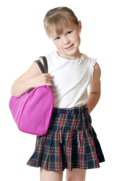 Das kleine Mädchen mit einer lila Tasche isoliert — Stockfoto