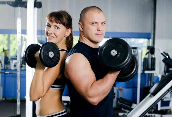 The woman with the trainer in sports club — Stock Photo, Image