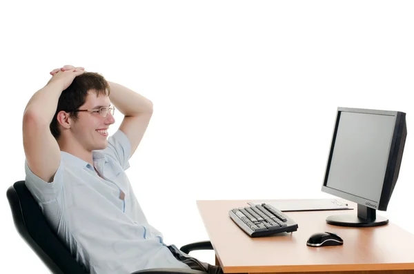 De zakenman achter een tafel met de computer — Stockfoto