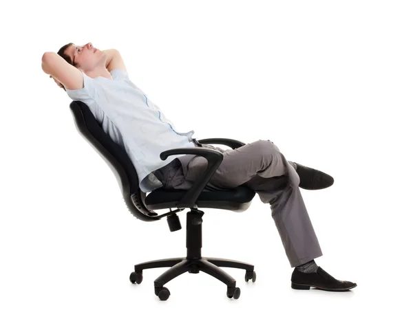 The businessman sits in an armchair — Stock Photo, Image