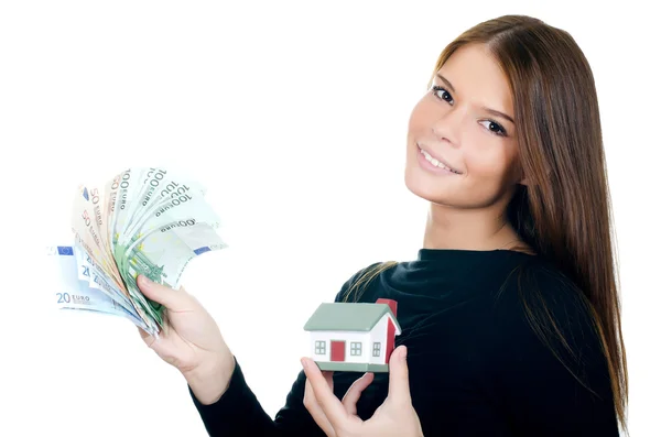 Obchodní žena s domem hraček a bankovky — Stock fotografie