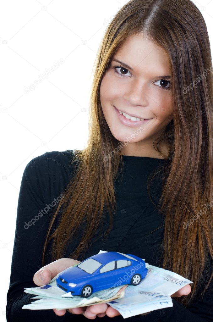 The beautiful woman with money and toy car in hands