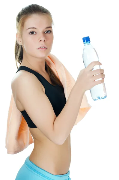 The sports girl with a towel and a water bottle — Stock Photo, Image
