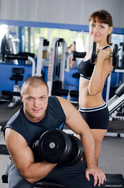 The woman with the trainer in sports club — Stock Photo, Image