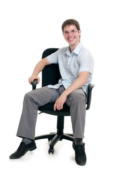 O empresário senta-se em uma poltrona — Fotografia de Stock