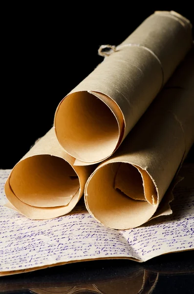 Many scrolls isolated on a black — Stock Photo, Image