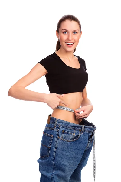 Mädchen demonstriert Gewichtsverlust — Stockfoto