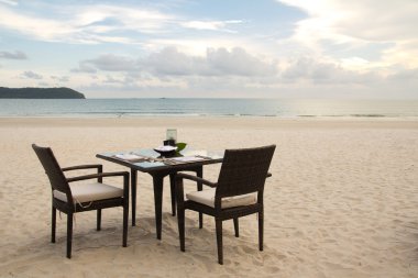 Dining table on beach clipart