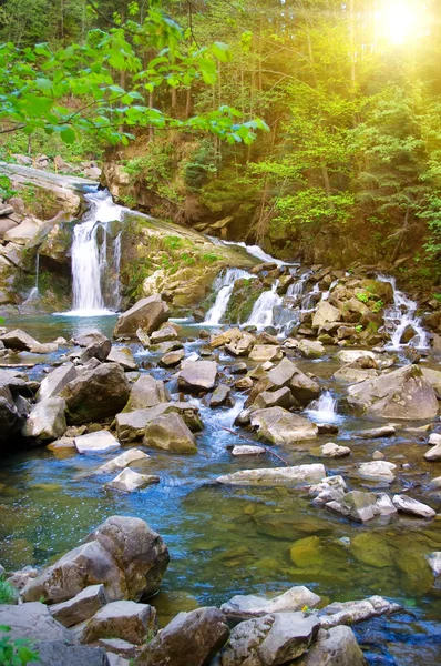 stock image Mountain river with a small waterfall