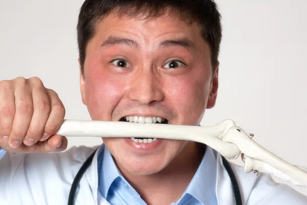 Doctor with a bone — Stock Photo, Image