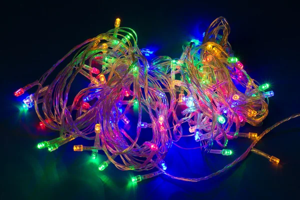 Multicolored electric christmas lights. Decorative festive garla — Stock Photo, Image