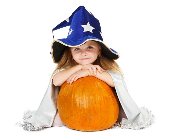 Girl in blue witch's hat with silver stars and pumpkin — Stock Photo, Image
