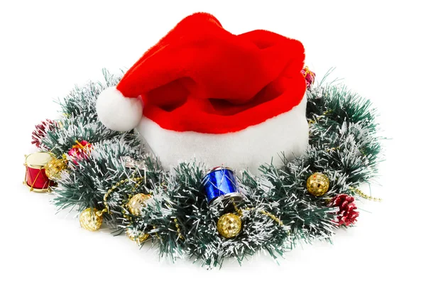 Santa claus red hat a vánoční věnec — Stock fotografie