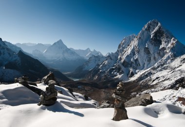 Cho La pass and stone stacks at daybreak in Himalayas clipart