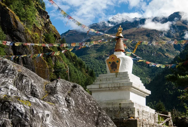 stock image Buddhist stupe or chorten with prayer flags in Himalayas