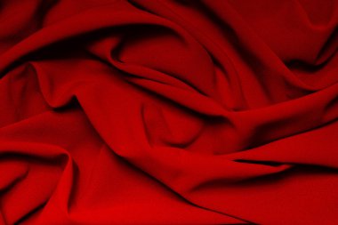 The folds of a bright red cloth. Abstract Background clipart