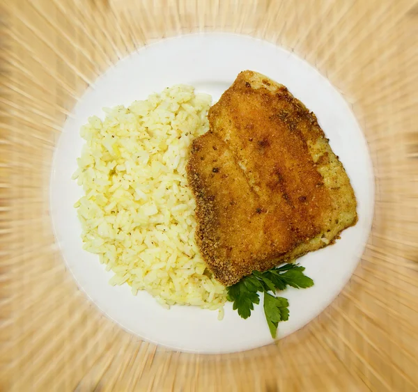 Fried tilapia with rice garnish — Stock Photo © pzRomashka 10251431