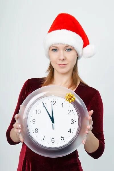 Young attractive girl with a clock — Stock Photo, Image