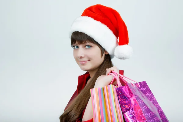 A girl in a Christmas hat — Stock Photo, Image
