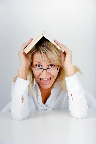 Funny blonde hidden under a book — Stock Photo, Image