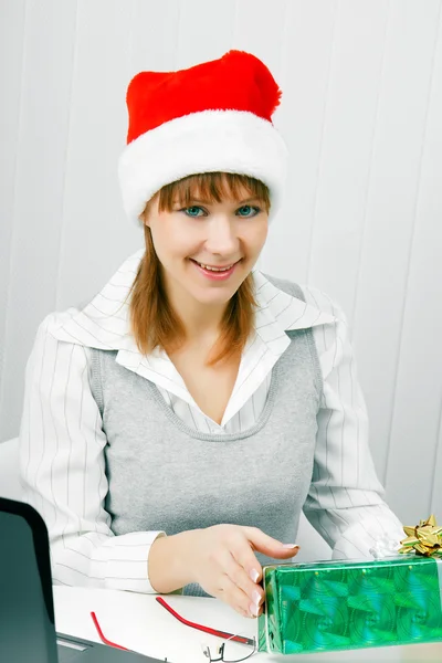 Attractive girl with a Christmas present — Stock Photo, Image