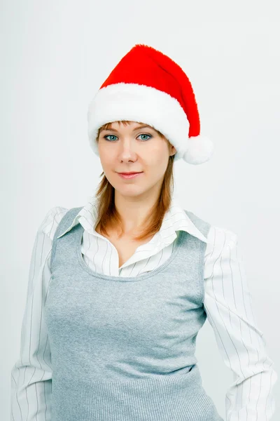 Aantrekkelijke jonge meisje in Kerstman hoed — Stockfoto
