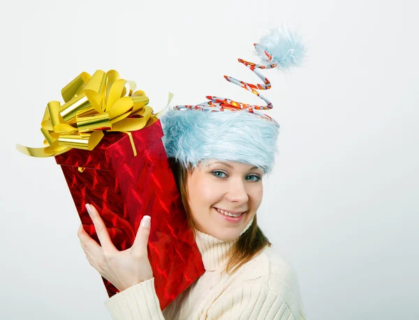 Portrait of a cheerful young woman in a funny Christmas hat — Stock Photo, Image