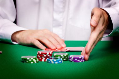 Men's hands, playing cards and chips clipart