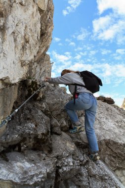 Female hiker in via ferrata