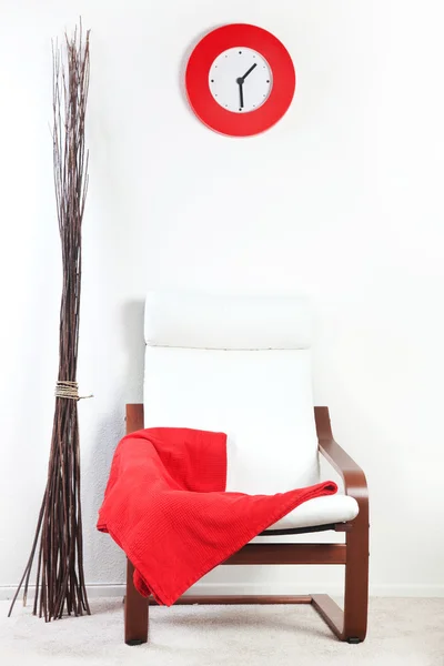 Red plaid draped over a chair — Stock Photo, Image