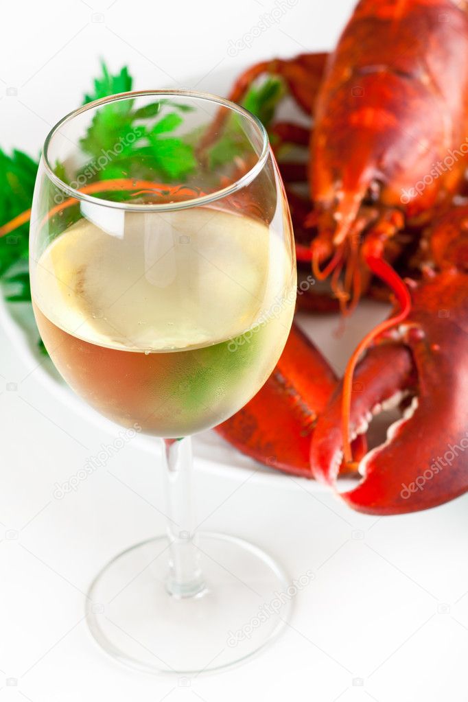 Glass of white wine with lobster