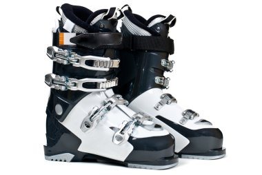 Modern professional ski boots isolated on white background clipart