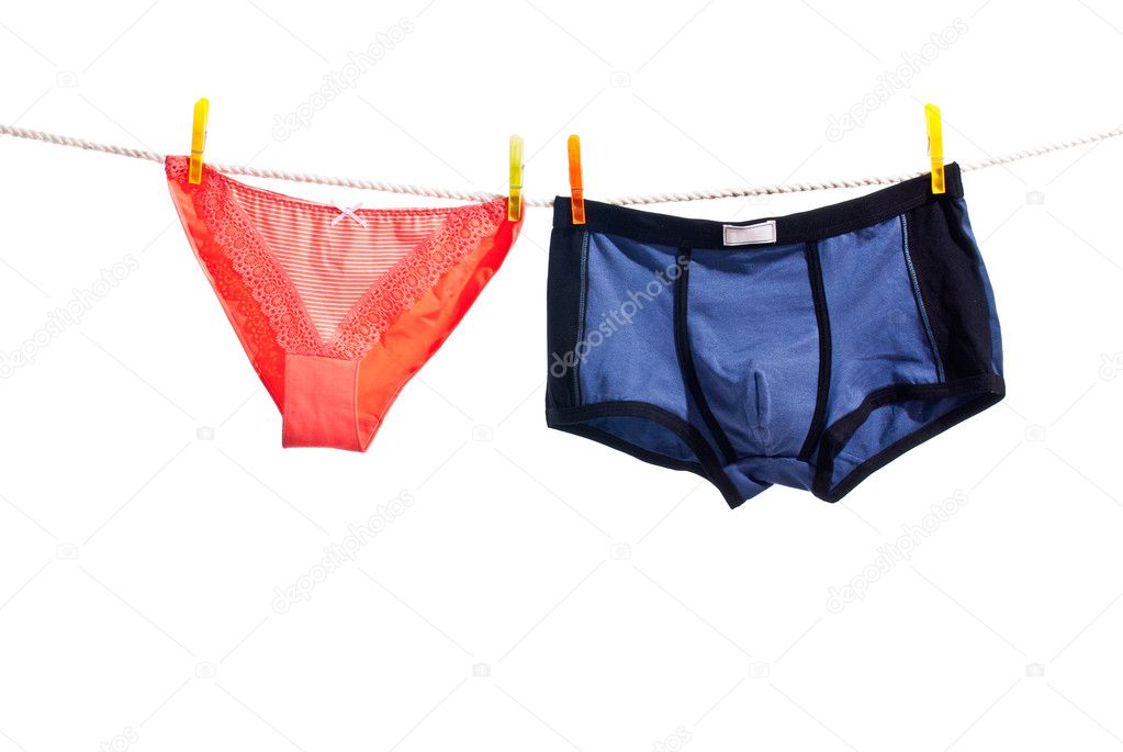 Red woman panties and blue man underwear on clothesline isolated