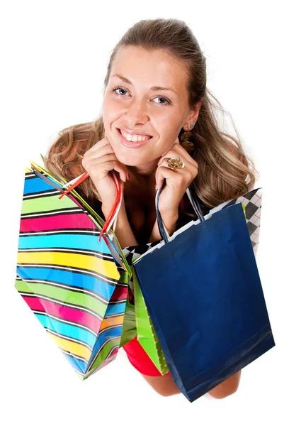 Portrait de jeune femme heureuse en robe avec des achats colorés ba — Photo