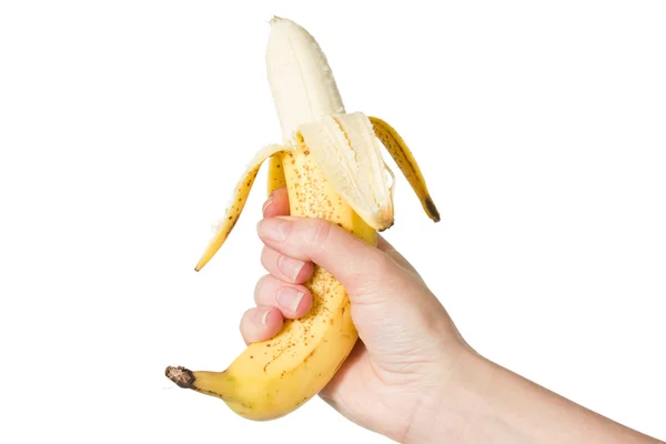 Ruka držící oloupaný banán — Stock fotografie