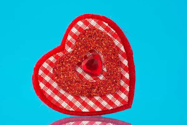 Red heart on blue background — Stock Photo, Image