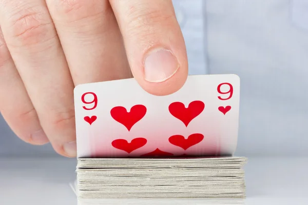 Hand avslöjar nio av hjärtan — Stockfoto