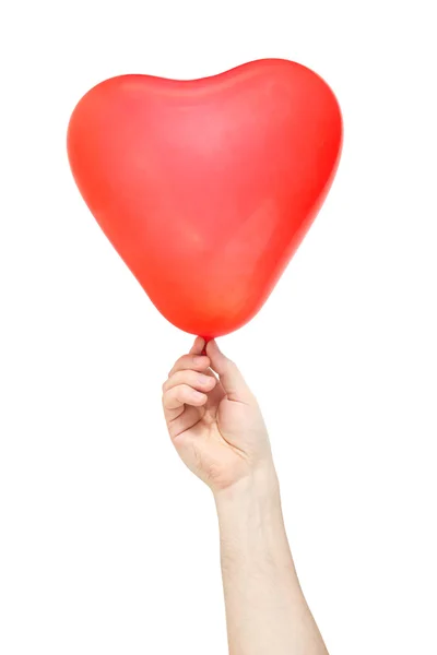 Mano tenere il palloncino a forma di cuore — Foto Stock