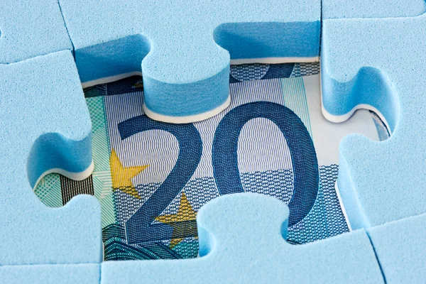 Blaue Puzzle auf Euro-Währung — Stockfoto
