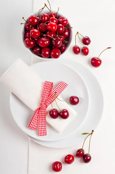 Decoration with fresh flowers and sweet cherry — Stock Photo, Image
