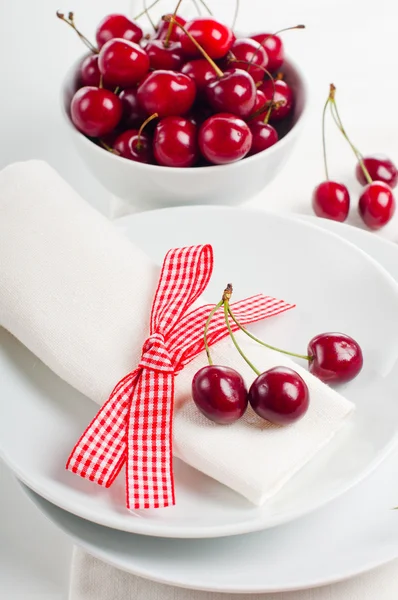 Decoration with fresh flowers and sweet cherry — Stock Photo, Image