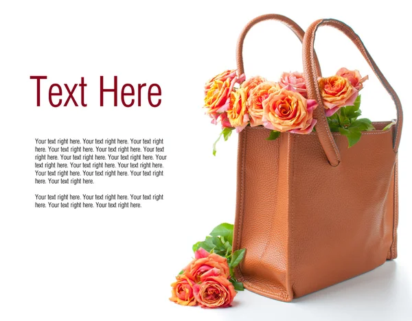 Arrangement with roses in a handbag — Stock Photo, Image