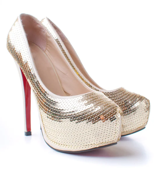 Zapatos de mujer con lentejuelas doradas —  Fotos de Stock