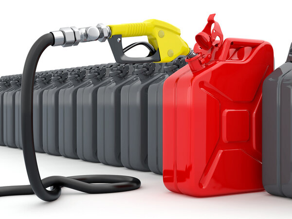 Gas pump nozzle and jerrycan on white background