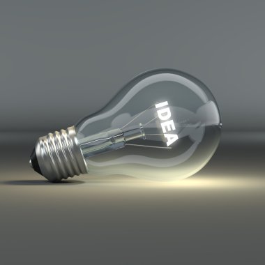 Light bulb with glowing text idea clipart