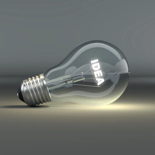 Glödlampa med glödande text idé — Stockfoto