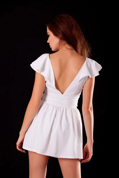 Back of young woman in cocktail dress — Stock Photo, Image