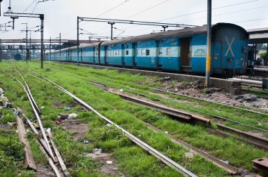 Train of the Indian railway on a station clipart